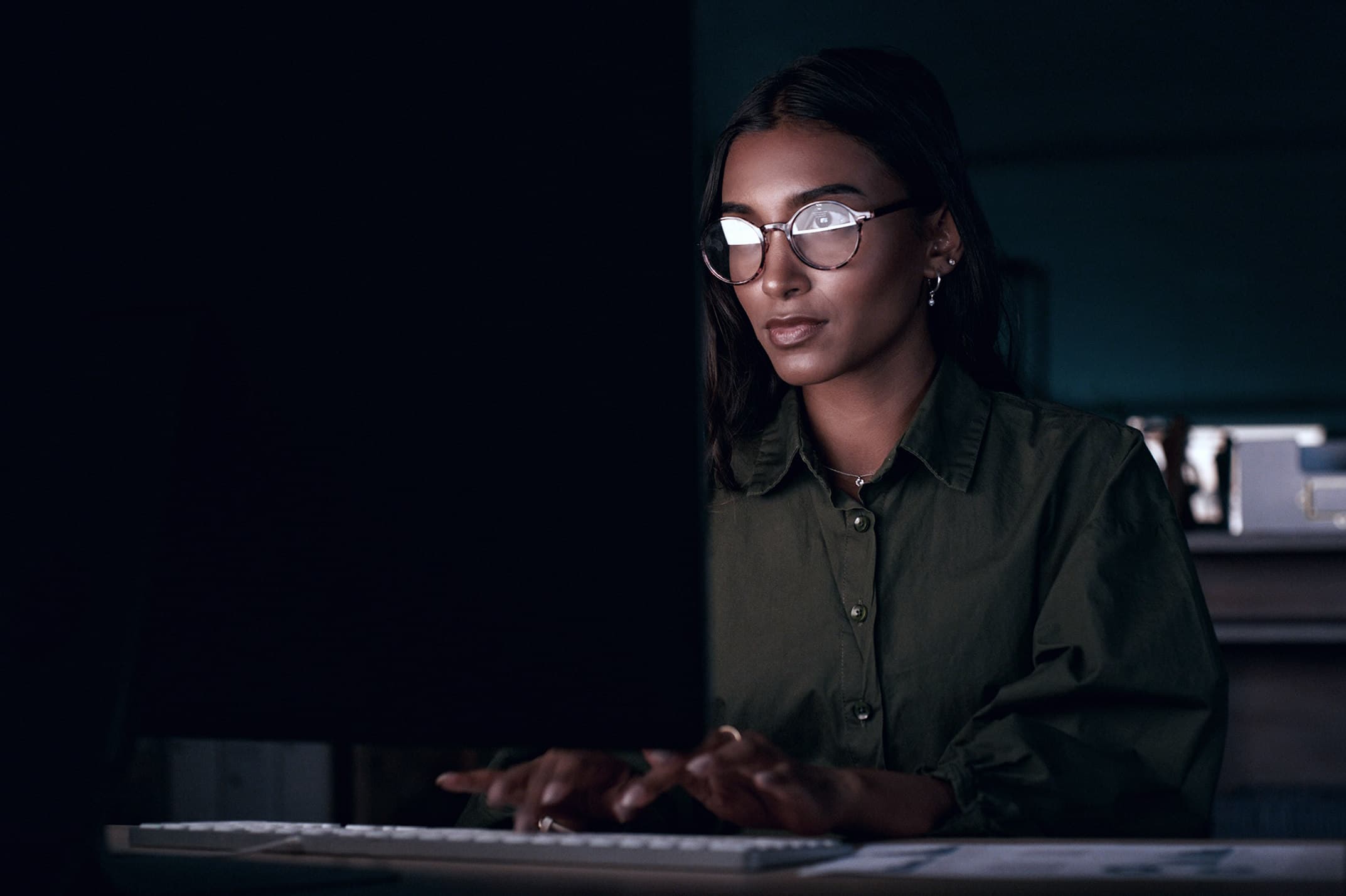 Professional woman with glasses working